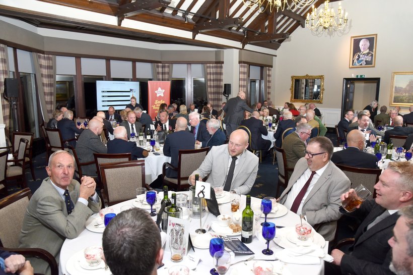 Group of men sat around a table at Action for Children event