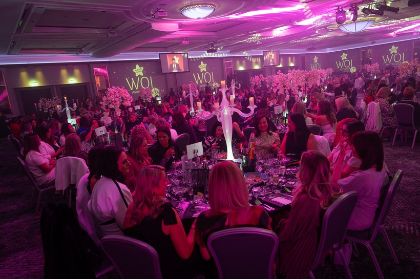 Guests seated in a ballroom for the Women of Influence Awards