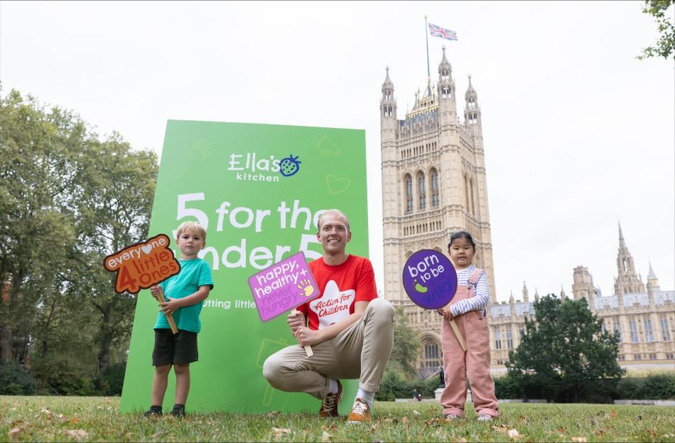 Two young children and man campaigning at parliament