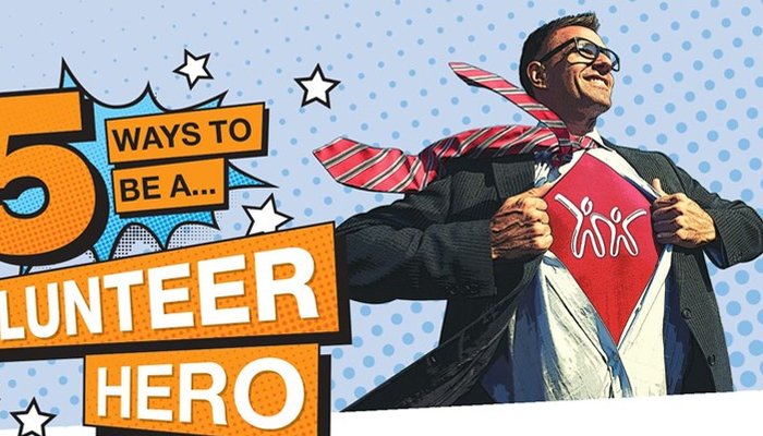 Man wearing Action for Children t-shirt dressed up like a super hero