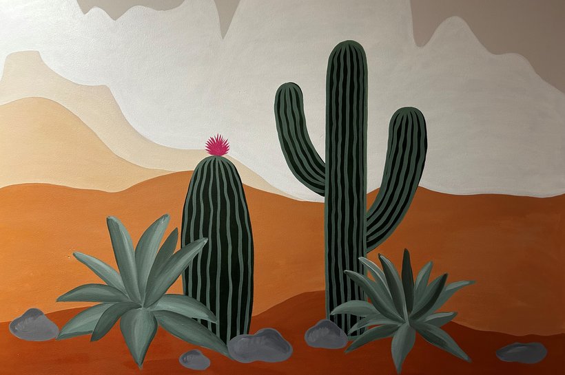 A wall painted to look like a desert