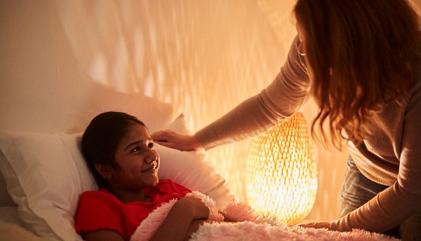 Young person in care saying goodnight to their carer