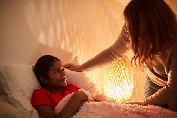 Young person in care saying goodnight to their carer