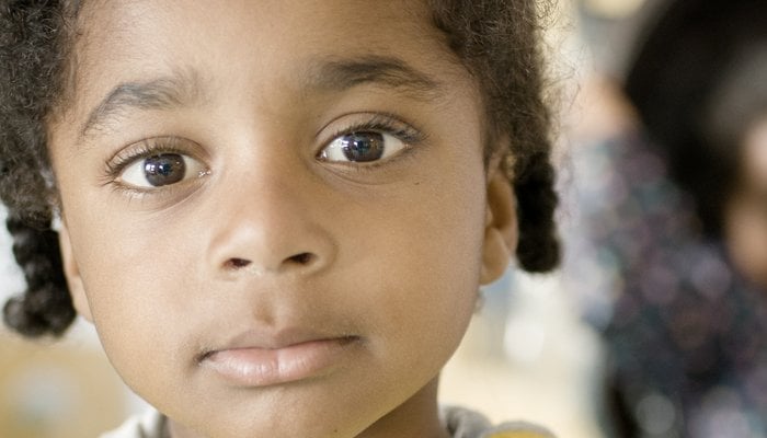 Arjan looking into camera wearing a yellow jumper