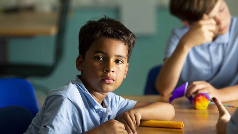 Boy in uniform neutral expression