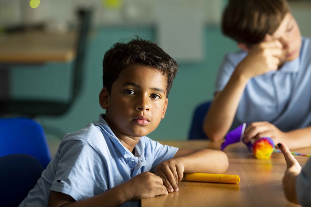 Boy in uniform neutral expression