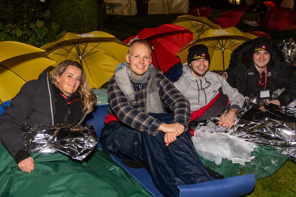 Boycott your Bed LIVE 2022 Sleepers sitting outside in their sleeping bags smiling