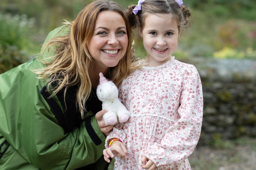 Charlotte Church smiling with young carer who is also smiling
