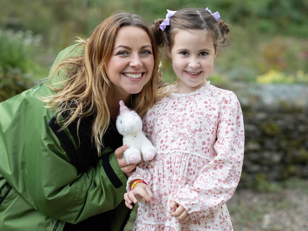 Charlotte Church smiling with young carer who is also smiling