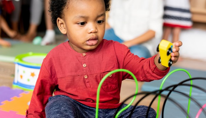 child_playing_with_toy