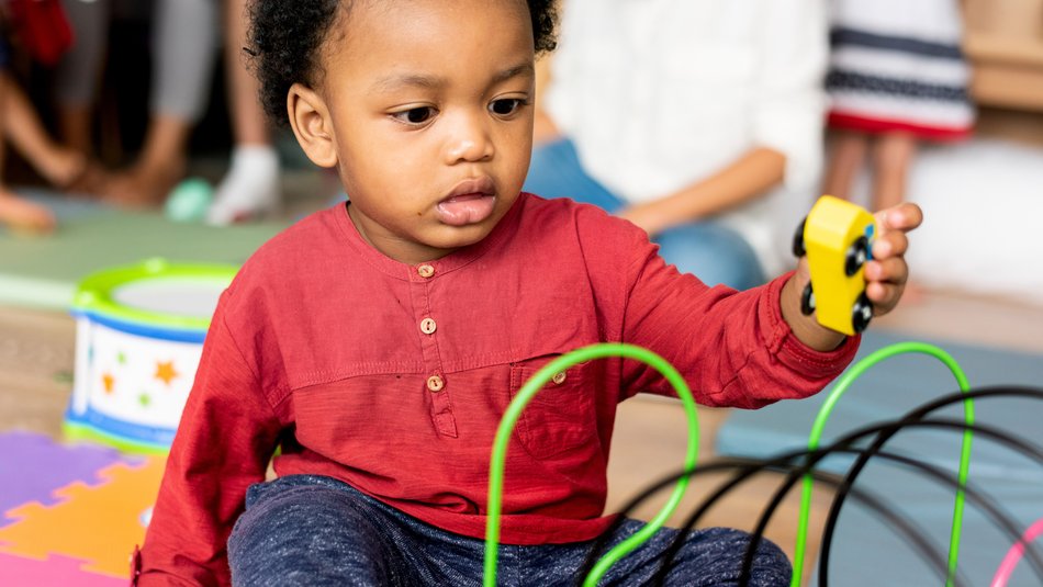 child_playing_with_toy