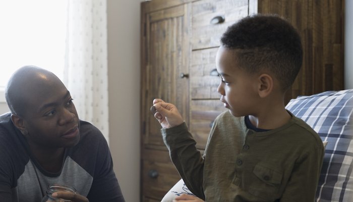 dad teaching son about money