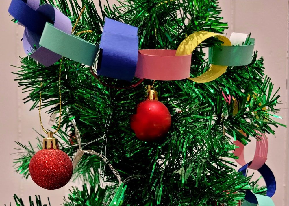 Paper Christmas garland and red baubles