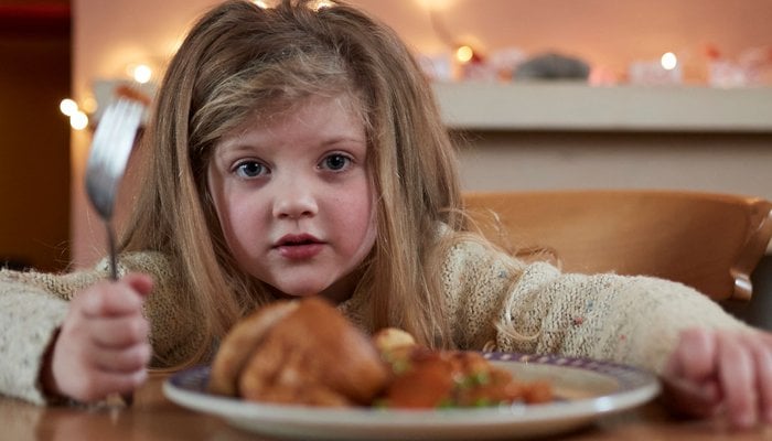 Girl eating dinner