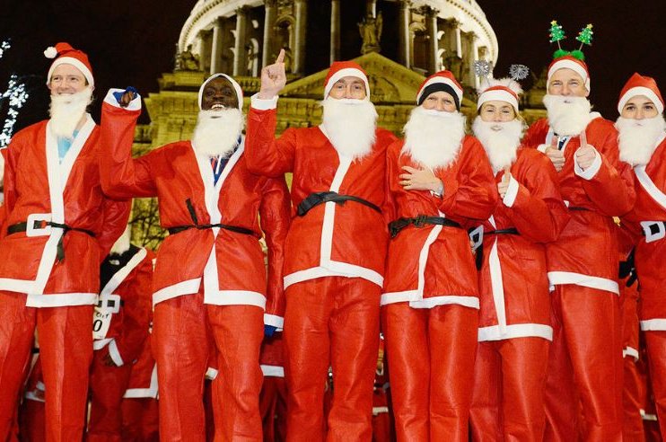 Group of men dressed as Santa for Santa in the City event