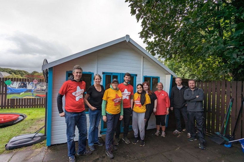 Group of people outdoors preparing to go on the Loom walk trek wearing Action for Children t shirts