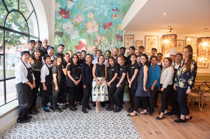 Group of Giggling Squid staff standing in a restaurant