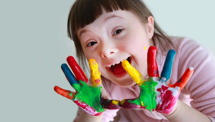 Happy girl with painted hands