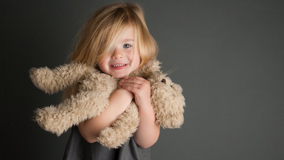 Happy girl with teddy bear