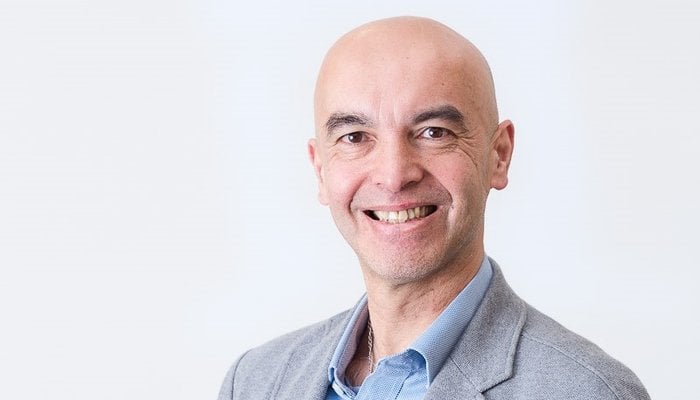 Headshot of Mike Knight on a neutral grey background