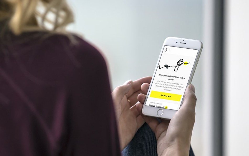 Lady using mobile phone to create a free will.jpg