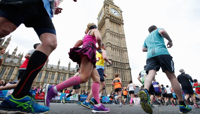 Marathon runners running past the Houses of Parliament