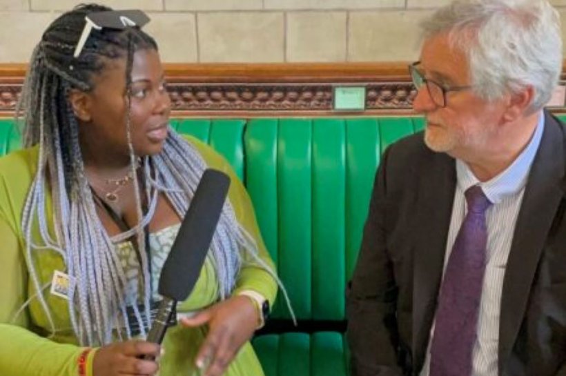 Young Ambassador Rachel interviewing a man