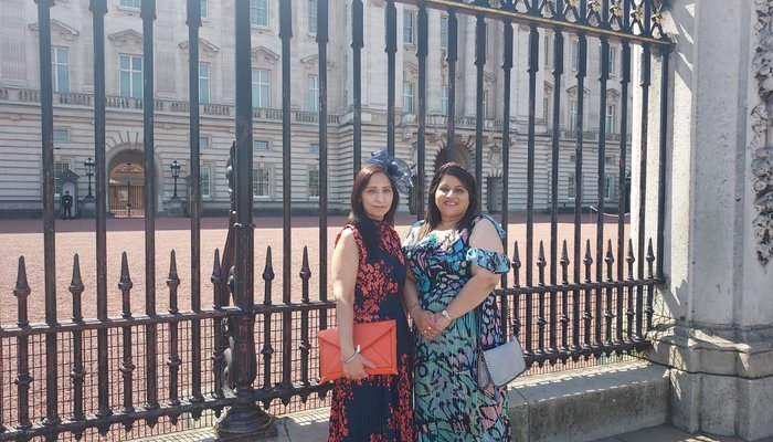 Raj and Amarjit outside the gates of Buckingham Palace at the Royal Garden Party