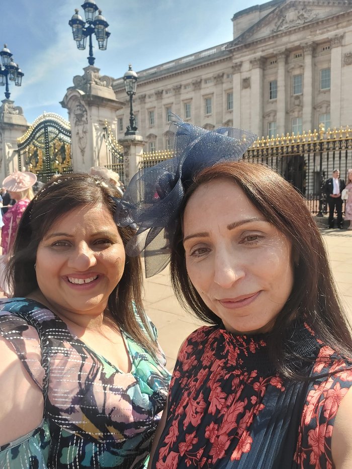 Raj and Amarjit taking a selfie outside of Buckingham Palace at the Royal Garden Party