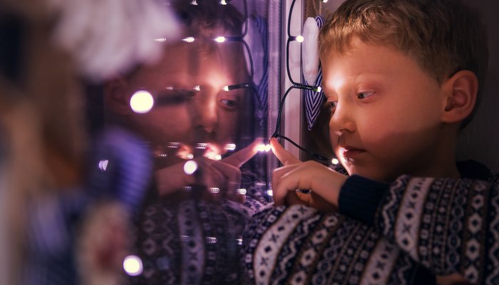 Boy looking out of the window at Christmas.jpg