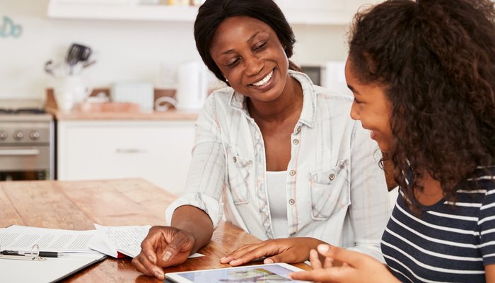 Teenager with carer smiling