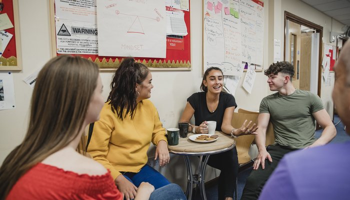 Teenagers Relaxing with Tea at Youth Club
