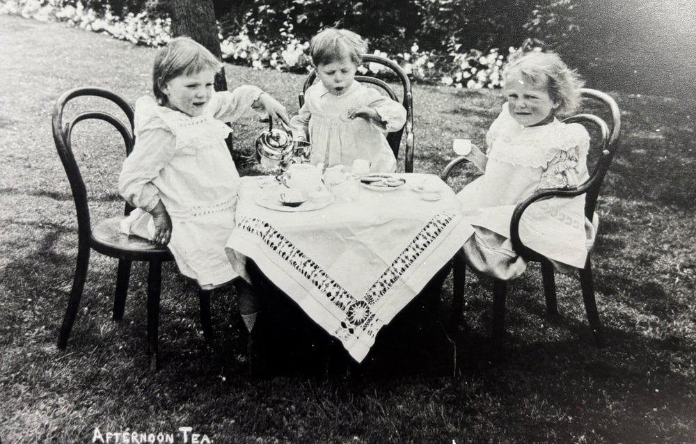Three girls having afternoon tea at NCH home in Chipping Norton 1909