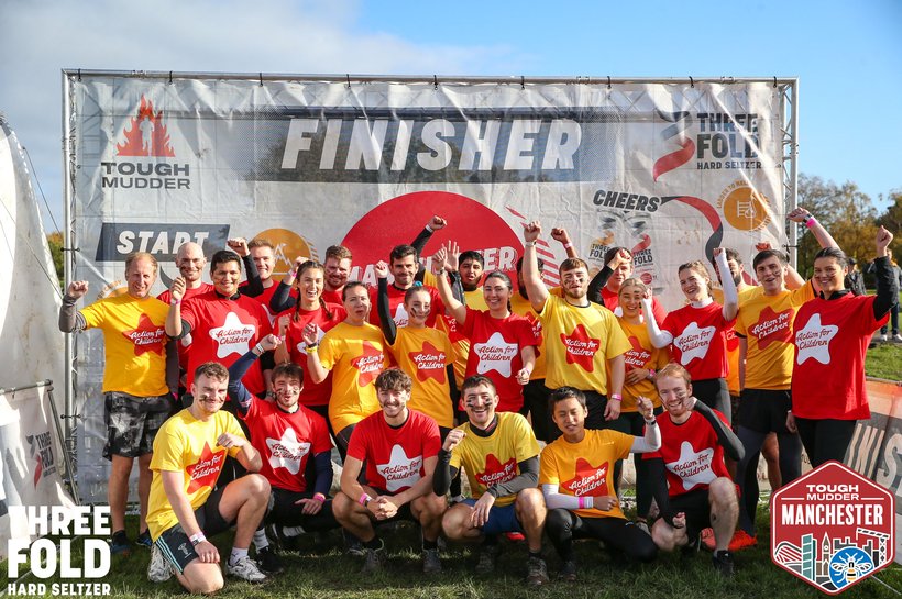 Turner_and_Townsend staff wearing Action for Children t-shirts cheering