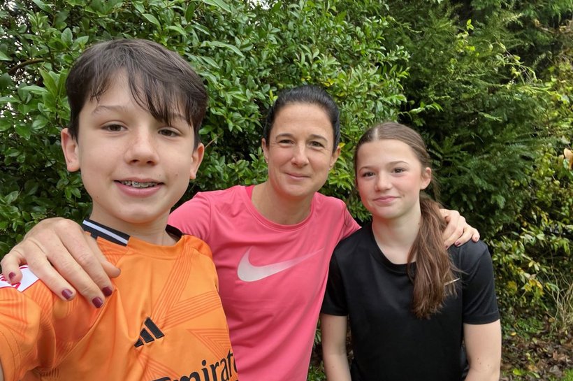 Vicky and her two children taking a selfie outdoors