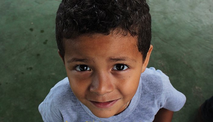 Worried young boy looking up