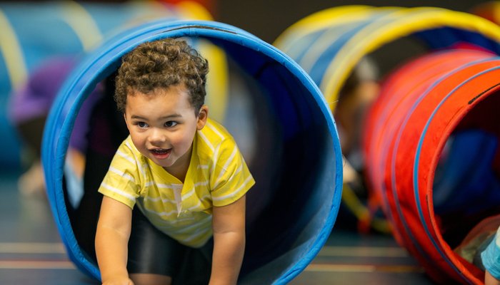 Young boy playing in play centre