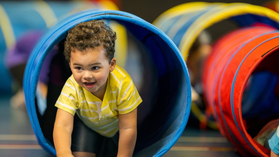 Young boy playing in play centre