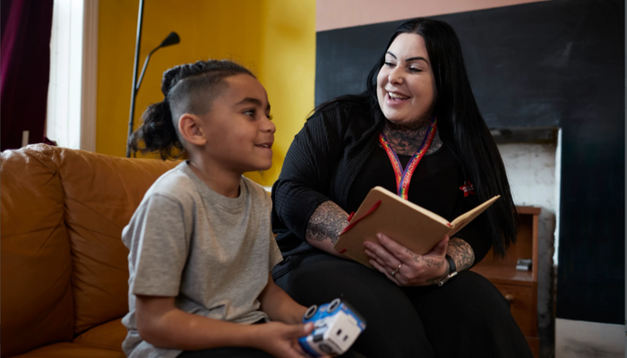 Action for Children support worker talking to boy
