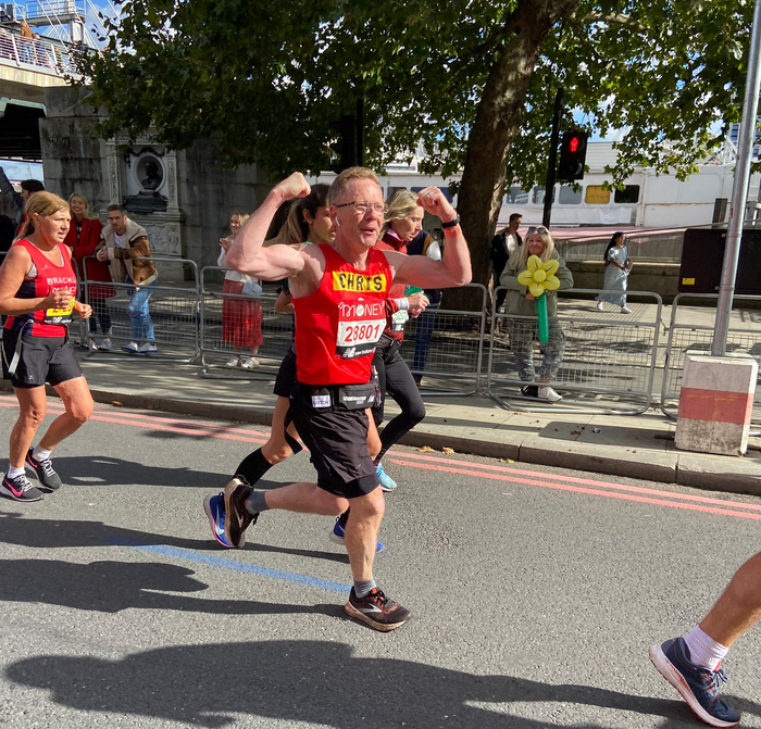 Male runner at the London Marathon 2021 in Action for Children vest