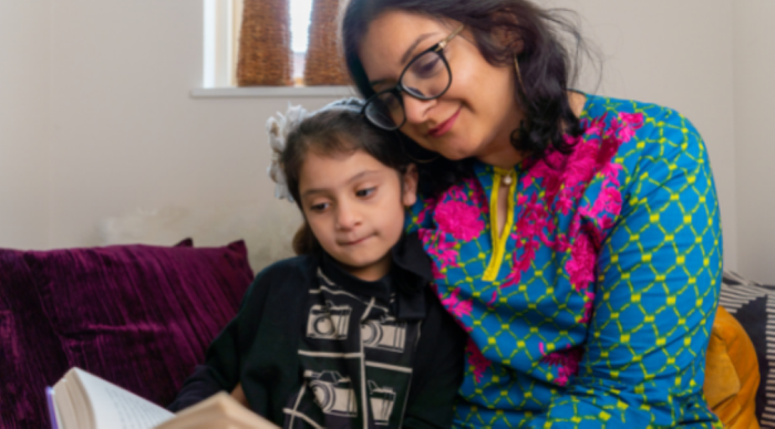 mother and daughter reading together