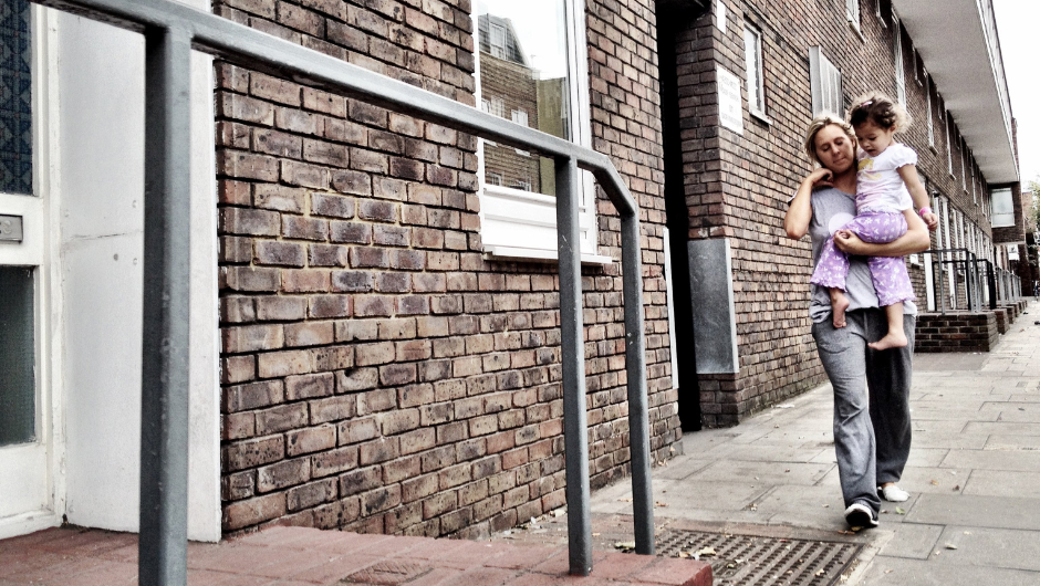 Mother and daughter walking outside council flat (flipped and cropped) 940x636px