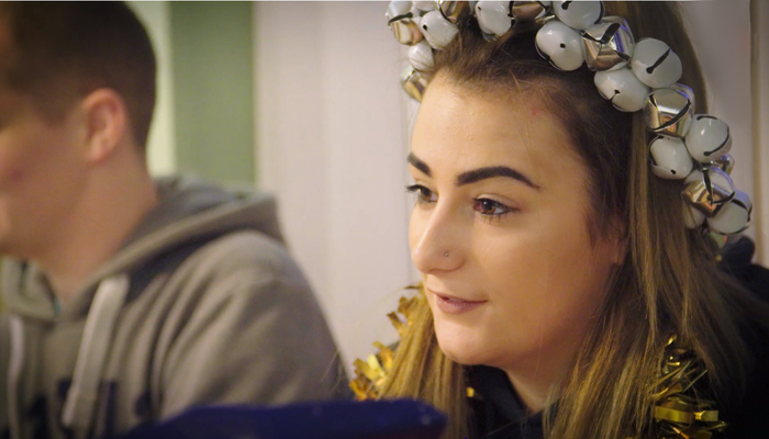 Nicole wearing tinsel at the Christmas table