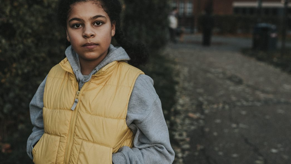 Young girl looking into camera