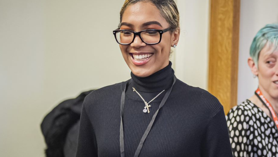 Young woman in a conversation smilling